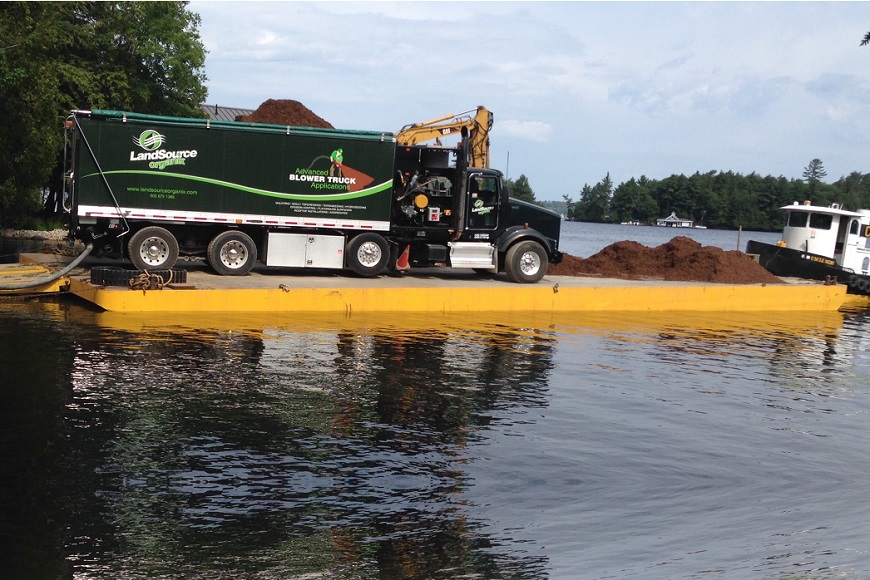 Using a Floating Barge to Blow in Mulch & Soil